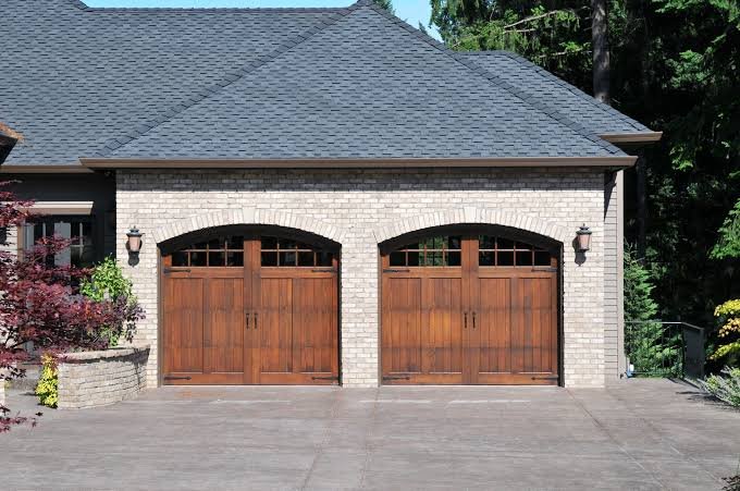 Two brown wooden garage doors